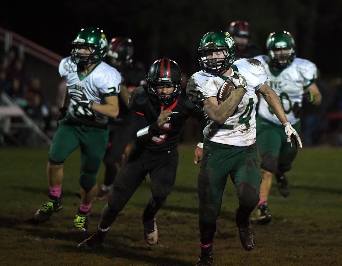 Northwest Christian running back Silas Perreiah (24) runs in for a Crusader touchdown during the first half of a high school football game at Liberty High School. (Colin Mulvany / The Spokesman-Review)