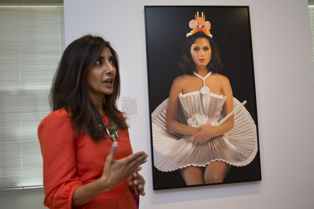 Asma Naeem, assistant curator of prints and drawings, speaks about a painting of singer Katy Perry, by artist Will Cotton, which is part of “Eye Pop: The Celebrity Gaze” at the National Portrait Gallery. (Associated Press)