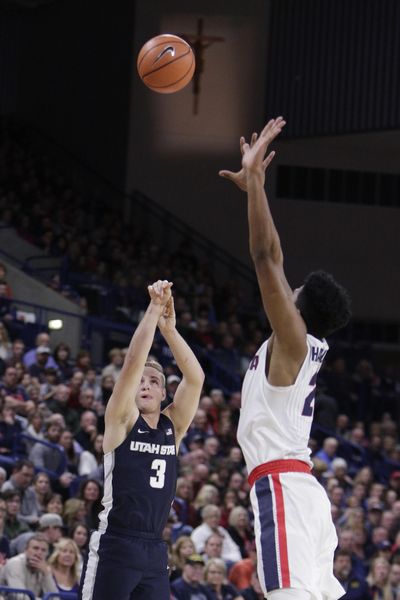 Utah State guard Sam Merrill (3) shoots against Gonzaga forward Rui Hachimura during the first half of an NCAA college basketball game in Spokane, Wash., Saturday, Nov. 18, 2017. (Young Kwak / Associated Press)