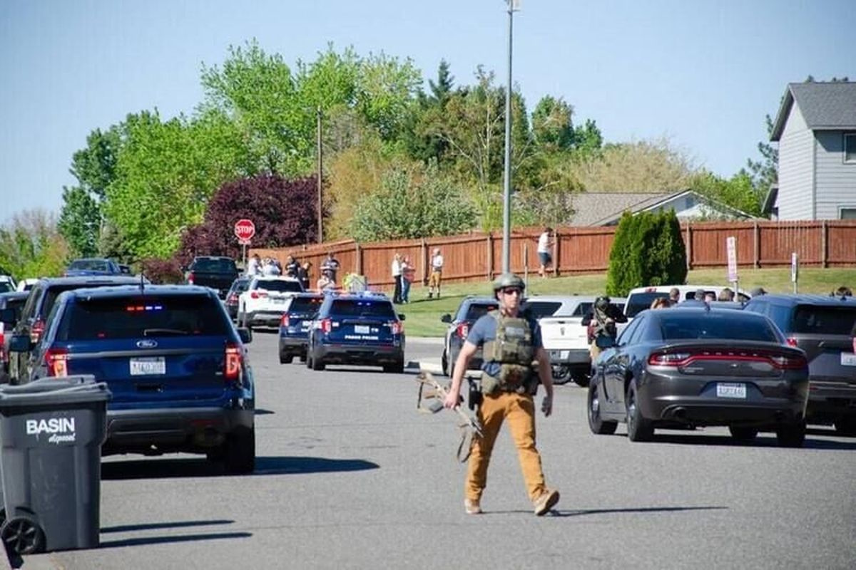 Richland police respond to the scene at a West Richland elementary school on Monday, in Richland, Wash.  (Tri-City Herald)
