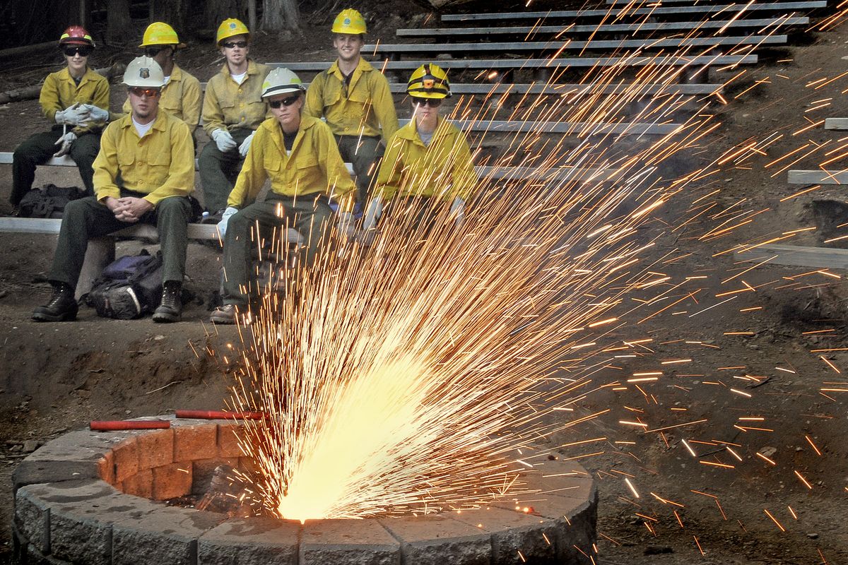 Wildland firefighter trainees learn the basics of setting backfires and watch a fuse burn during a workshop at the Chewelah Peak Learning Center outside Chewelah on Thursday June 18, 2009. Forty-seven trainees from northeastern Washington attended a week long interagency training from federal, state and tribal agencies. (Christopher Anderson / The Spokesman-Review)