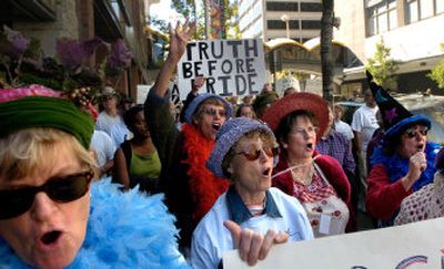 
 Raging Grannies, left to right, Joanna McPherson, Joanne Bailey, Katie Krauss, Myrta Ladich and Valerie Harper-Murdoch raise their arms and voices against the war in Iraq Saturday afternoon during a march to Riverfront Park. 
 (Amanda Smith / The Spokesman-Review)