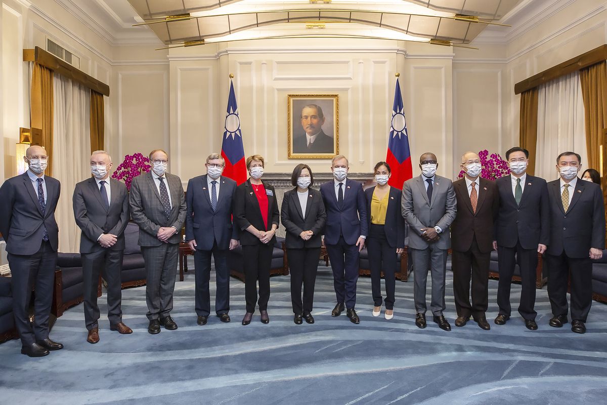 In this photo released by the Taiwan Presidential Office, Taiwan president Tsai Ing-wen, center left, poses for photos with Francois de Rugy, the head of the Taiwan Friendship group in the National Assembly, center right, and other French lawmakers during a visit at the Presidential Office in Taipei, Taiwan, Dec. 16, 2021. Rugy is who is leading a team of French lawmakers from the French National Assembly on a five-day visit to Taiwan.  (HOGP)