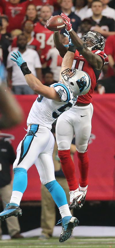 Atlanta Falcons wide receiver Julio Jones goes up over Carolina Panthers linebacker Luke Kuechly for a long touchdown pass from Matt Ryan to take a 14-10 lead over the Panthers during the third quarter of an NFL football game on Sunday, Dec. 27.