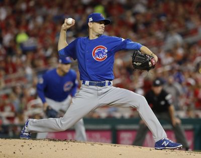 Chicago Cubs starting pitcher Kyle Hendricks held the Washington Nationals to two singles over seven innings. (Pablo Martinez Monsivais / AP)