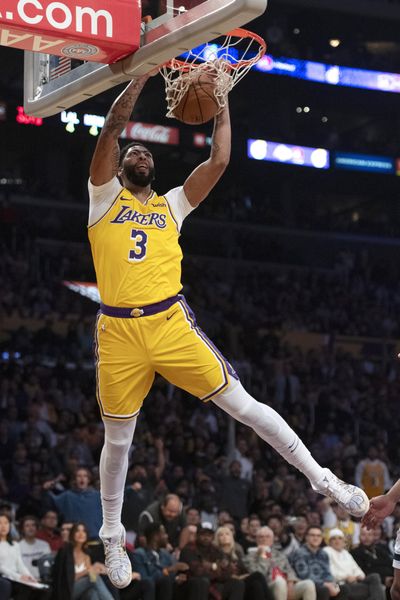 Los Angeles Lakers forward Anthony Davis dunks during the second half of the team’s NBA basketball game against the Memphis Grizzlies in Los Angeles, Tuesday, Oct. 29, 2019. (Kyusung Gong / Associated Press)