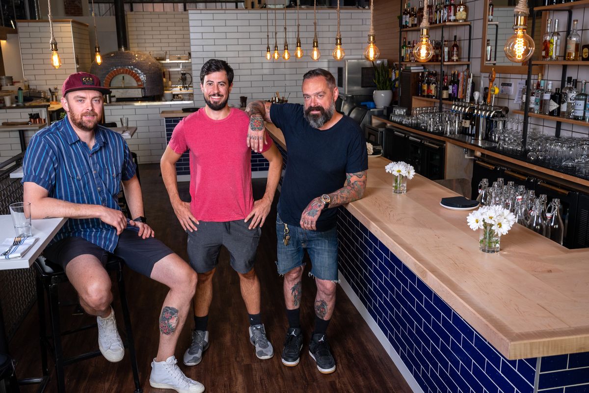 Owners Abe Fox, Jon Green and Eddie Gulberg opened Wooden City Spokane at 821 W. Riverside Ave. on Aug. 12. Green also serves as executive chef and handles the restaurant’s social media.  (Colin Mulvany/The Spokesman-Review)
