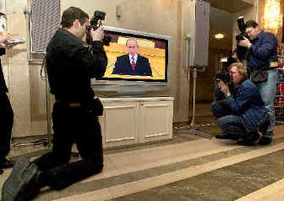 
Photographers cover the national television broadcast of Russian President Vladimir Putin's annual state-of-the-nation address in Moscow's Kremlin on Monday. The photographers were allowed only three minutes to take photos. 
 (Associated Press / The Spokesman-Review)