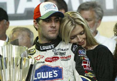 
 Jimmie Johnson and his wife Chandra savor his Nextel Cup title. 
 (Associated Press / The Spokesman-Review)
