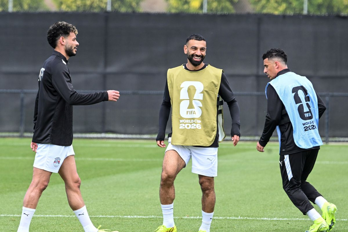 Egypt’s Mohamed Salah, center, jokes with his teammates Wednesday during a public practice for the Egyptian men’s national soccer team at Gonzaga University’s Luger Field. Spokane is the Egyptian team’s base camp for the World Cup taking place across the country. (Jesse Tinsley/THE SPOKESMAN-REVIEW)