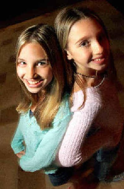 
Asya, 13, right, and her sister Chloe, 11, of the music group Smoosh, are photographed at Slim's in San Francisco. 
 (Associated Press / The Spokesman-Review)