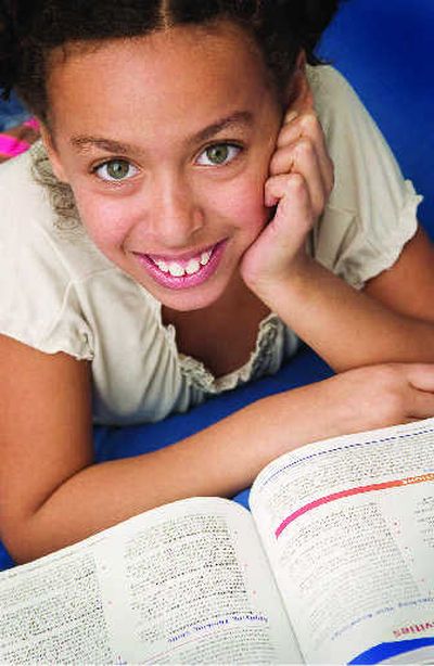 
Encouraging kids to read can be a great way to promote their cognitive development.
 (Metro Services / The Spokesman-Review)