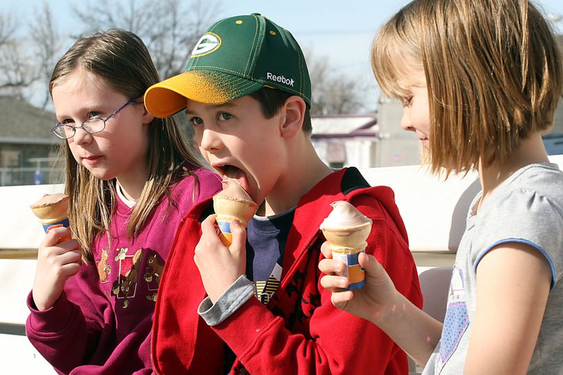 In this Wednesday, March 24, 2010 photo, Andrew Beardsley, 12, center, and his sisters Ashley Beardsley, 10, left, and Audrey Beardsley, 8, all of Bozeman, Mont., devour ice cream cones at Dairy Queen Wednesday, March 24, 2010, while visiting their grandparents, Allen and Francy Beardsley, during their spring break in Havre, Mont. (Nikki Carlson / Havre Daily News)