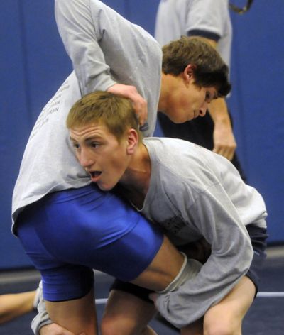 Central Valley High junior Jared Maynes works out with state-ranked 135-pounder senior T.J. Delmedico at practice Tuesday. A two-time state finisher, Maynes took third place at state last year at 112 pounds.bartr@spokesman.com (J. BART RAYNIAK)