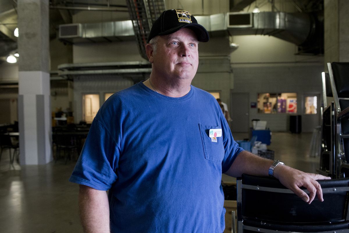 Chris Courtney, a highway engineer and Army veteran, takes a break from volunteering for Second Harvest food bank on May 21. (Jesse Tinsley)