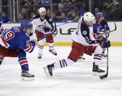 Columbus Blue Jackets' Cam Atkinson, right, scores during the third period of the NHL hockey game against the New York Rangers, Sunday, Feb. 26, 2017, in New York. (Seth Wenig / Associated Press)