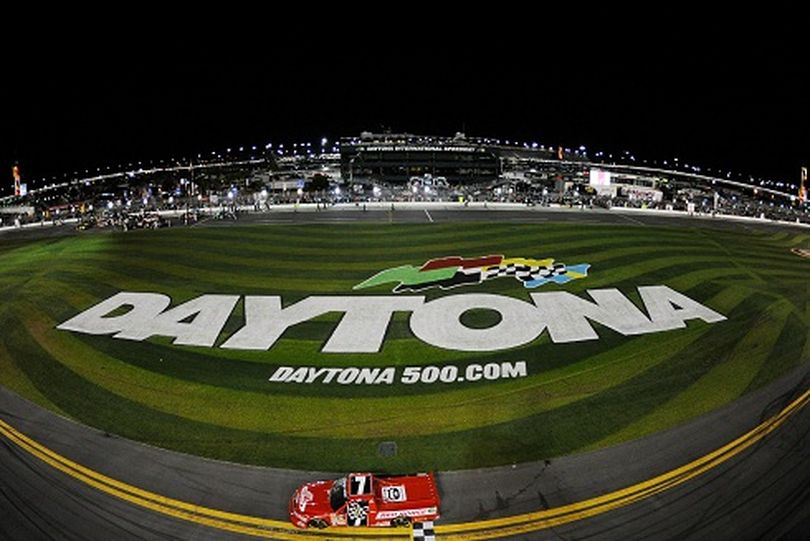 DAYTONA BEACH, FL - FEBRUARY 24: John King, driver of the #7 Red Horse Racing Toyota, celebrates with the checkered flag after winning the NASCAR Camping World Truck Series NextEra Energy Resources 250 at Daytona International Speedway on February 24, 2012 in Daytona Beach, Florida. (Photo by Chris Graythen/Getty Images) (Chris Graythen / Getty Images North America)