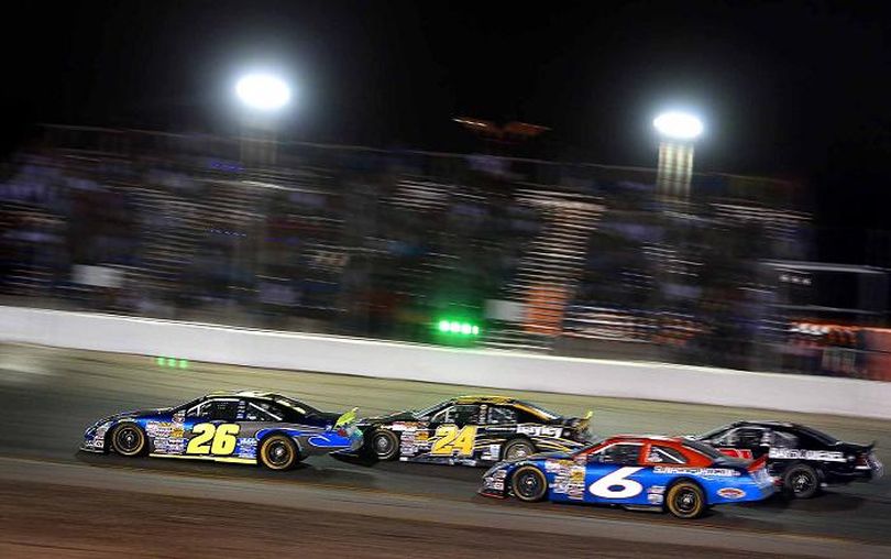 Greg Pursley (26) leads  the way down the stretch over Cameron Hayley (24) Derek Thorn (6) and Michael Self (21). (Photo Credit: Marc Piscotty/Getty Images for NASCAR) (Marc Piscotty / Getty Images North America)