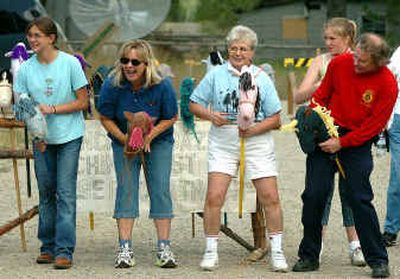 
Racers, from left, Hailey Gentry, Jan Rudd, Mae Cannon and Tom Curotto ham it up at the beginning of a 