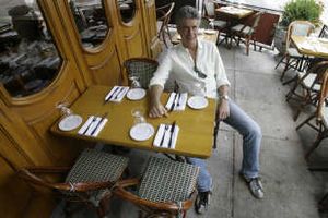 
Anthony Bourdain, host of theTravel Channel's "No Reservations," shown posing in a New York restaurant, says he has an "enduring passion" for Asia. Associated Press
 (Associated Press / The Spokesman-Review)