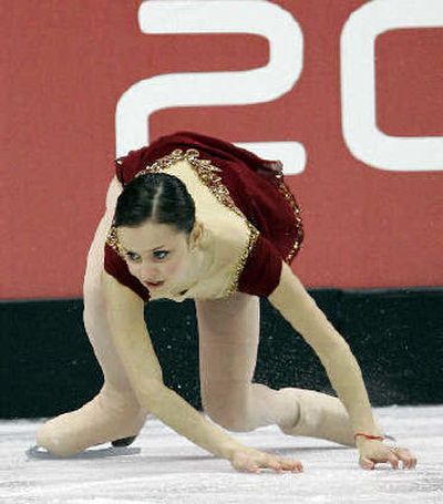 
Sasha Cohen scrambles to her feet after falling during the Olympic women's free skate on Thursday. She won the silver medal. 
 (Associated Press / The Spokesman-Review)