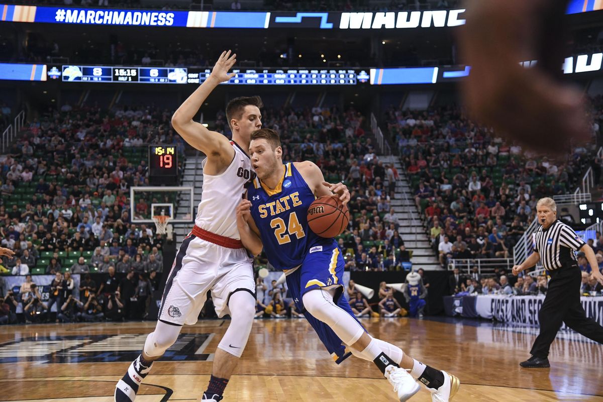 Gonzaga forward Zach Collins defends on South Dakota State forward Mike Daum (24) during the first half of a first round NCAA men’s college basketball tournament game, Thurs., March 16, 2017, at the VivInt Smart Home Arena in Salt Lake City. (Dan Pelle / The Spokesman-Review)