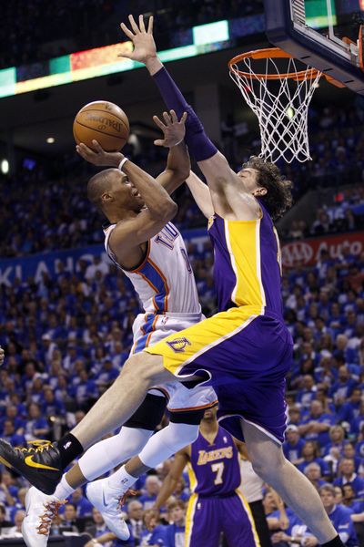 Oklahoma City Thunder guard Russell Westbrook, left, put up big numbers for the Thunder in a blowout of the Los Angeles Lakers. (Associated Press)