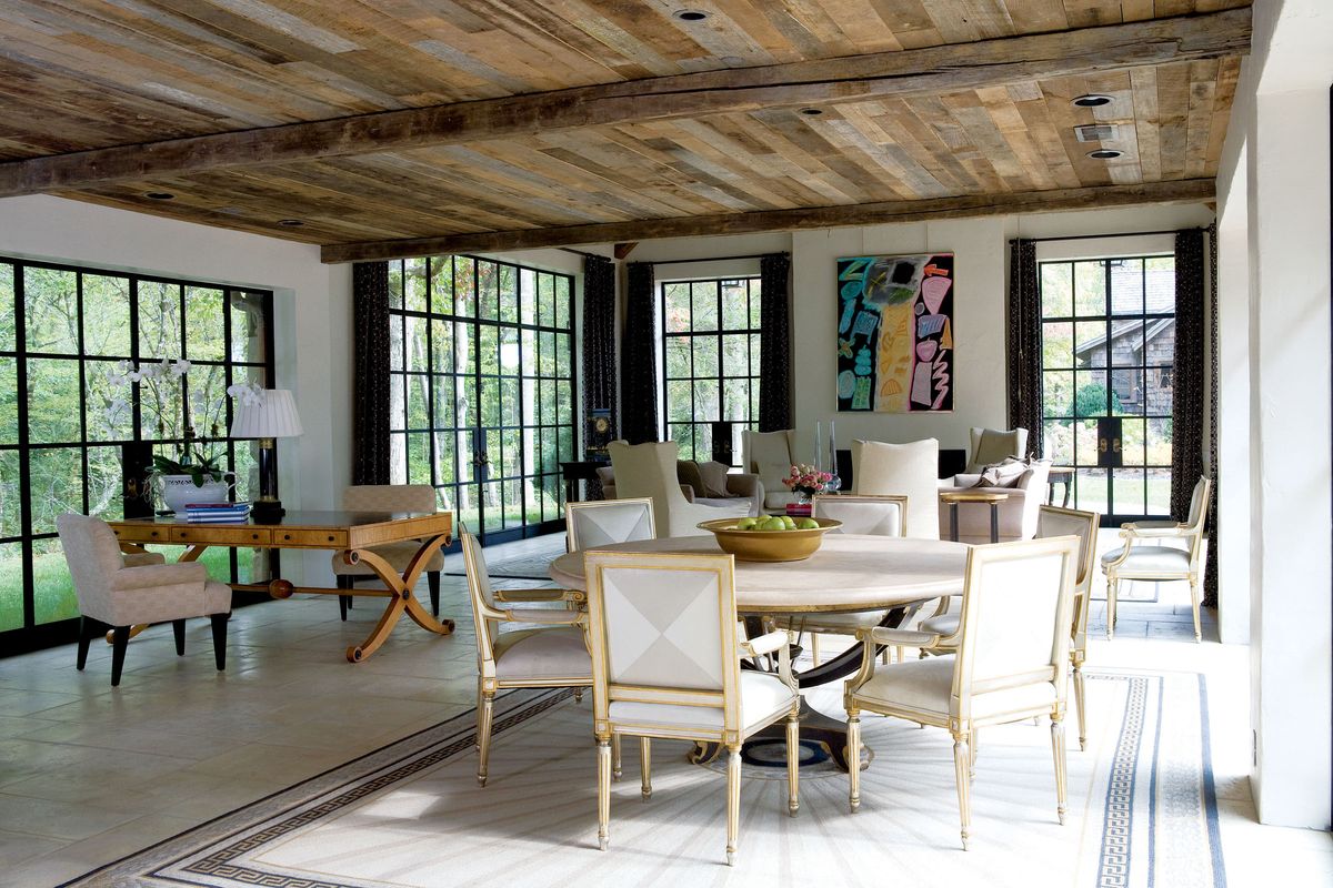This photo from Rizzoli USA shows how white slipcovers, floors and furnishings work together.   (Associated Press)