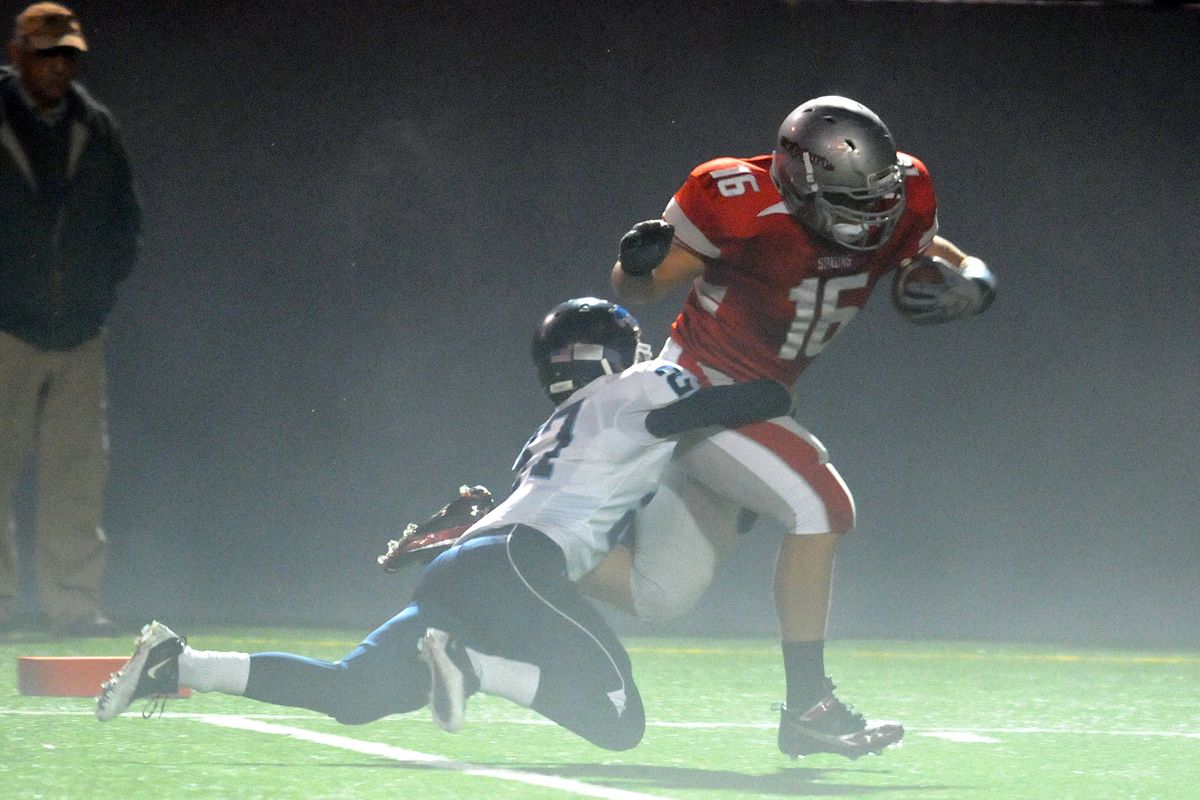 Ferris' Drew Sharkey drags Sean Padon of Gonzaga Prep across the goal line for a touchdown in the first half Friday, Oct. 29, 2010 at Joe Albi Stadium. (Jesse Tinsley / The Spokesman-Review)