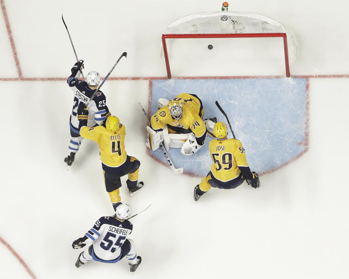 Winnipeg Jets center Paul Stastny (25) scores a goal against Nashville Predators goalie Juuse Saros (74), of Finland, during the third period in Game 7 of an NHL hockey second-round playoff series Thursday, May 10, 2018, in Nashville, Tenn. The Jets won 5-1, and advanced to the Western Conference final. (Mark Humphrey / Associated Press)