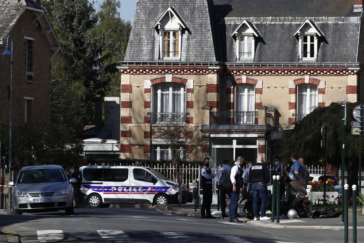 Police officers gather next to the Police station in Rambouillet, south west of Paris, Friday, April 23, 2021. A French police officer was stabbed to death inside her police station Friday near the famed historic Rambouillet chateau, and her attacker was shot and killed by officers at the scene, authorities said. The identity and the motive of the assailant were not immediately clear, a national police spokesperson told The Associated Press. The police officer was a 49-year-old administrative employee in the station, the spokesperson said.  (Michel Euler)