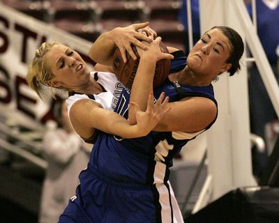 Feb.20 2009 Nampa, Idaho, USA; Coeur d' Alene Kama Griffitts battles for the ball with Centennial's Taylor Hagood (21) in the closing seconds of overtime verse the Centennial Patriots during the Championship  game at the Idaho Center in Nampa.  STEVE CONNER Special to The Spokesman-Revieww (Steve Conner / The Spokesman-Review)