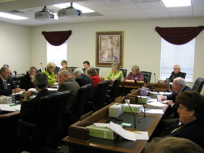 Members of the Joint Finance Appropriations Committee review the impact of 4 percent budget holdbacks on state agencies, 1/14/09  (Betsy Russell / The Spokesman-Review)