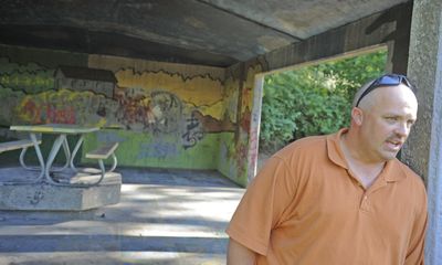 Eric Walker, who works in graffiti abatement with the Spokane Police Department, stands at the picnic shelter in lower Lincoln Park on Tuesday and expresses his concern about how slowly some of the tagging gets cleaned up. (CHRISTOPHER ANDERSON / The Spokesman-Review)