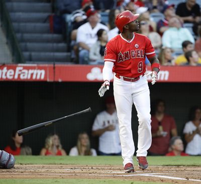 In this Sept. 16, 2017 photo, the Los Angeles Angels’ Justin Upton watches his home run against the Texas Rangers during the first inning of a game in Anaheim, Calif. (Chris Carlson / Associated Press)