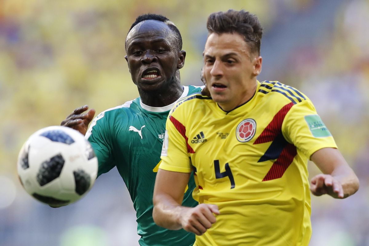 Colombia’s Santiago Arias, foreground, and Senegal’s Sadio Mane challenge for the ball during the Group H match between Senegal and Colombia, at the 2018 soccer World Cup in the Samara Arena in Samara, Russia, Thursday, June 28, 2018. (Efrem Lukatsky / Associated Press)
