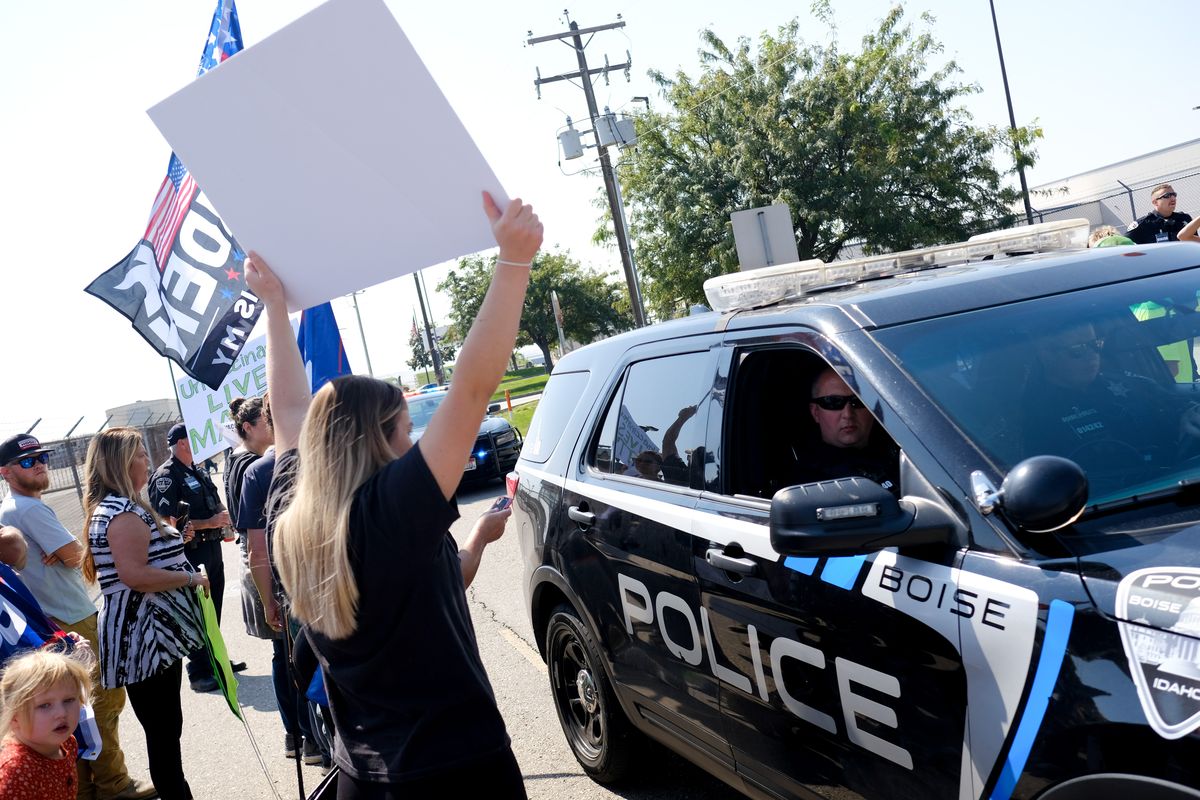 Protesters gather outside the National Interagency Fire Center in objection to President Joe BidenÕs visit to Idaho on Monday, Sep 13, 2021, in Boise, ID. Biden was in Boise for a briefing at the National Interagency Fire Center and to speak with Gov. Brad Little and Boise Mayor Lauren McLean.  (Tyler Tjomsland/The Spokesman-Review)