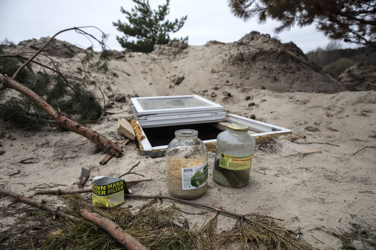 A jar of pickles and sauerkraut are left at a position where Russian forces set up a large camp on the outskirts of Vorzel, Ukraine, a suburb of Kyiv. MUST CREDIT: Photo for The Washington Post by Heidi Levine  (Heidi levine/For The Washington Post)
