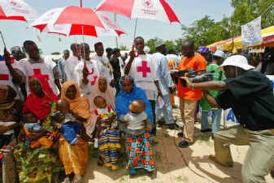 
Mothers wait with their children in July to be immunized at the launching of polio immunizations at Takai, in Nigeria. 
 (File/Associated Press / The Spokesman-Review)