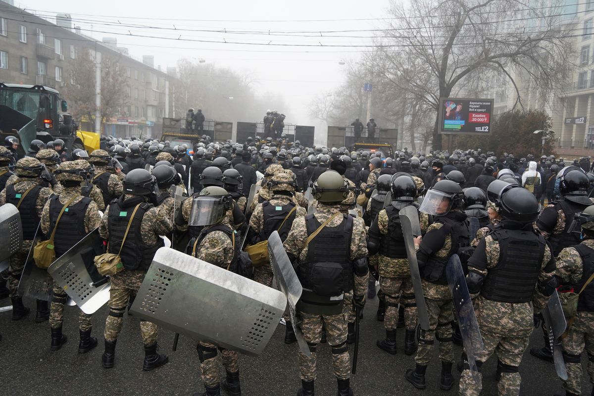 Riot police block a street to prevent demonstrators during a protest in Almaty, Kazakhstan, Wednesday, Jan. 5, 2022. Demonstrators denouncing the doubling of prices for liquefied gas have clashed with police in Kazakhstan