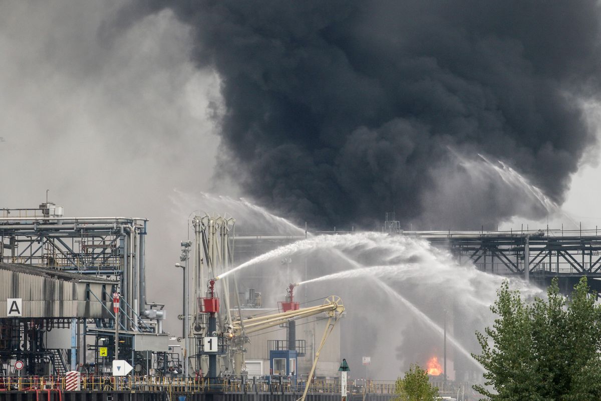 Smoke and fire rise from a facility belonging to chemical firm BASF in Ludwigshafen, southwestern Germany, Monday Oct. 17, 2016. The company said that several people were injured in a late-morning explosion. (Frank Rumpenhorst / Associated Press)