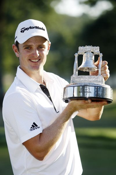Justin Rose poses after winning the AT&T National golf tournament. (Associated Press)