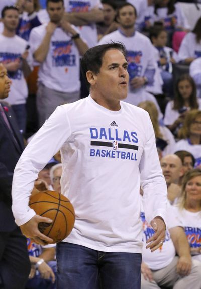 FILE - Dallas Mavericks owner Mark Cuban says he banned two ESPN writers, Marc Stein and Tim MacMahon, from Mavericks home games to bring attention to the issue of companies using automation in sports coverage. (Alonzo Adams / Associated Press)