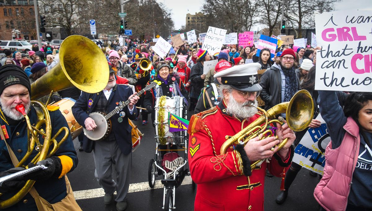 Members of the PJAMRS (Peace and Justice Activist Musical Rascals of Spokane) perform along Spokane Falls Blvd. during the Women’s March, Saturday, Jan. 19,2019, in Spokane, Wash. (Dan Pelle / The Spokesman-Review)