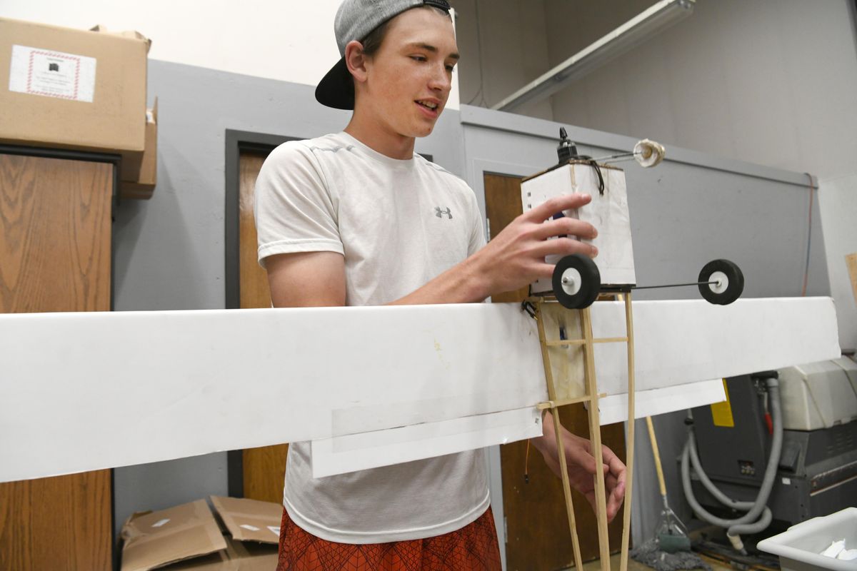 Casey Lemon, a sophomore, holds an original design radio-controlled plane that he and other students built at Riverpoint Academy, shown Friday. Lemon has an interest in RC airplanes and motorsports, which includes a riding lawnmower on which he and a friend mounted a racing engine. The school is eagerly awaiting the delivery of an industrial grade 3-D printer it purchased with a $23,860 grant from the Hagan Foundation in early 2019. (Jesse Tinsley / The Spokesman-Review)