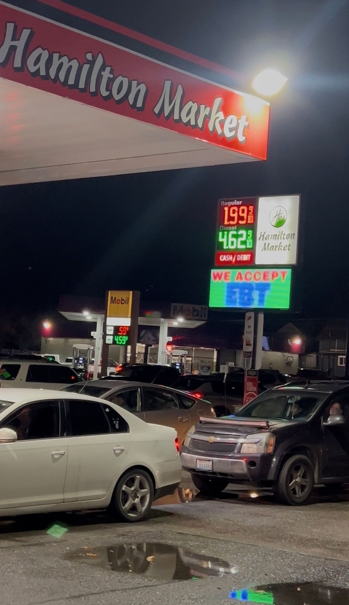 An image from Wednesday night’s gas war between Hamilton Market and the Mobil across the street. (Courtesy of Rahul Singh)