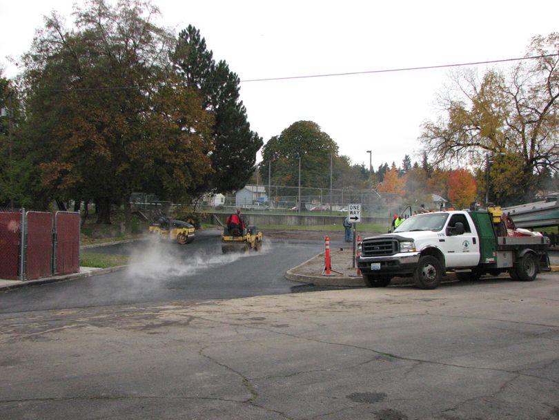 The parking lot just west of South Perry Street is begin paved on the morning of Oct. 28, 2010. The lot belongs to the Spokane Parks Department and is the main 