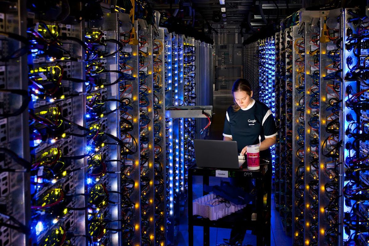 This photo provided by Google shows a Google technician working on some of the computers in The Dalles, Ore., data center. (Associated Press)