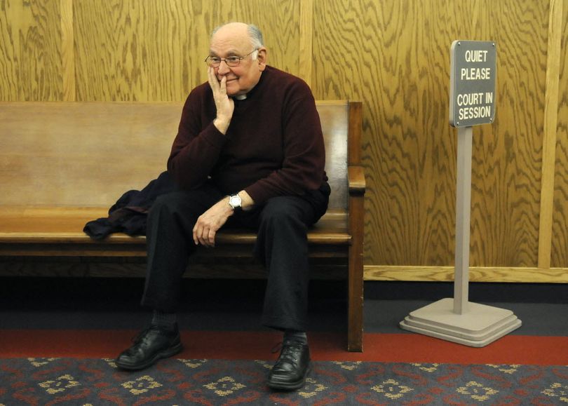  The Rev. Joseph Weitensteiner waits in the fourth-floor hallway of the Spokane County Courthouse to testify in the Morning Star Boys’ Ranch trial on Wednesday. 
 (Dan Pelle)