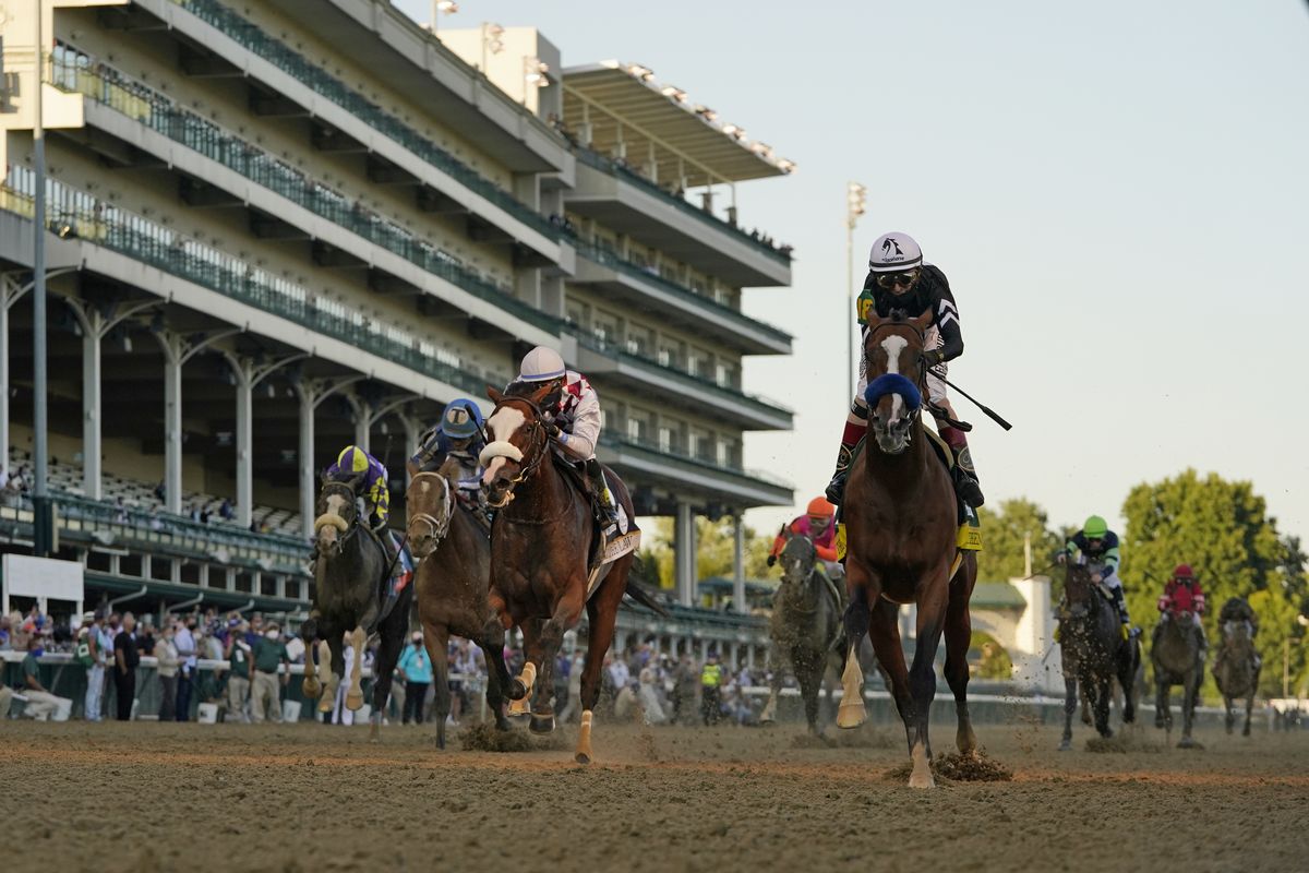Jockey John Velazquez riding Authentic, right, crosses the finish line to win the 146th running of the Kentucky Derby at Churchill Downs, Saturday, Sept. 5, 2020, in Louisville, Ky.  (Associated Press)